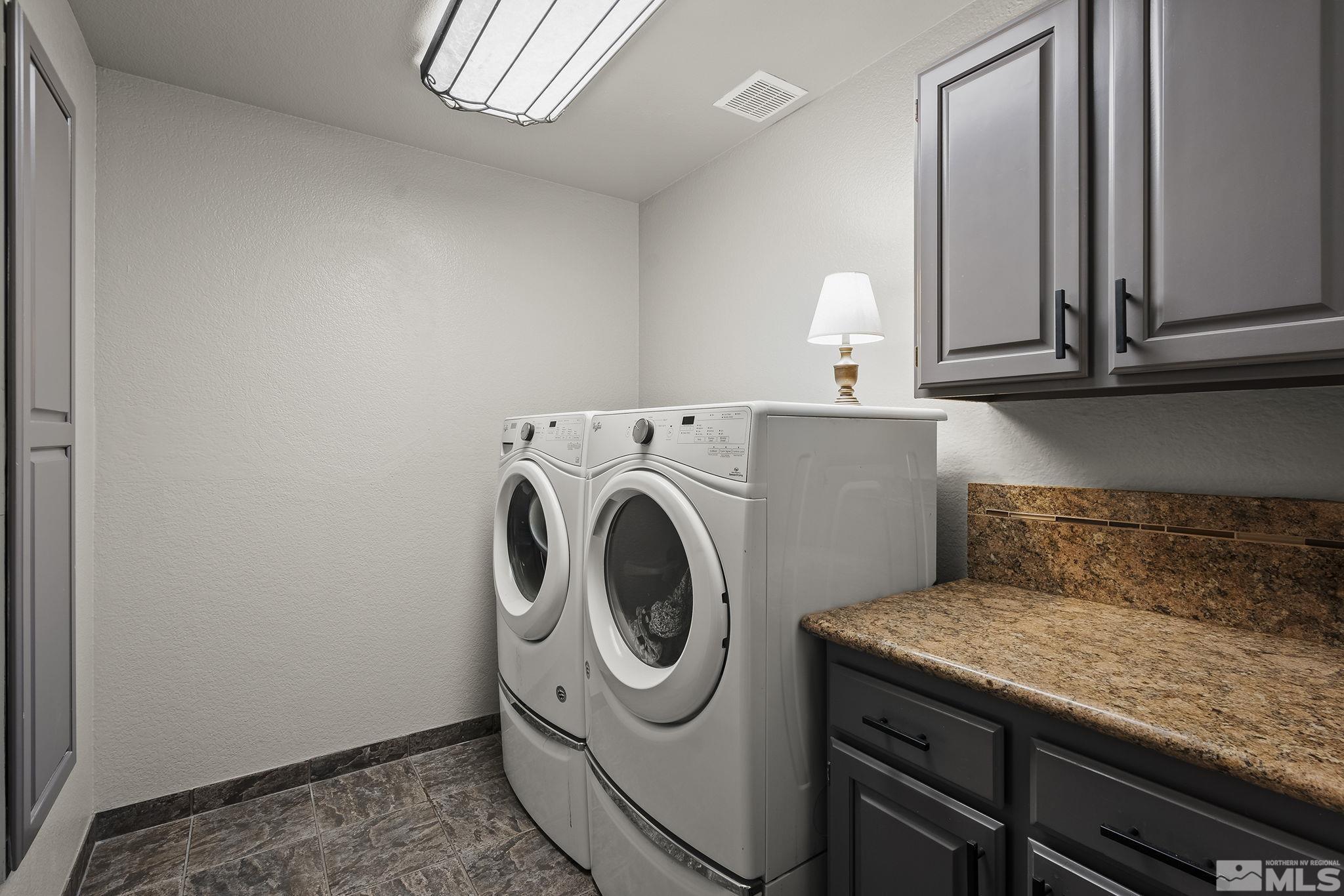 10890 Osage Road Reno, NV 89508 - Photo 24 of 40 a utility room with dryer and washer