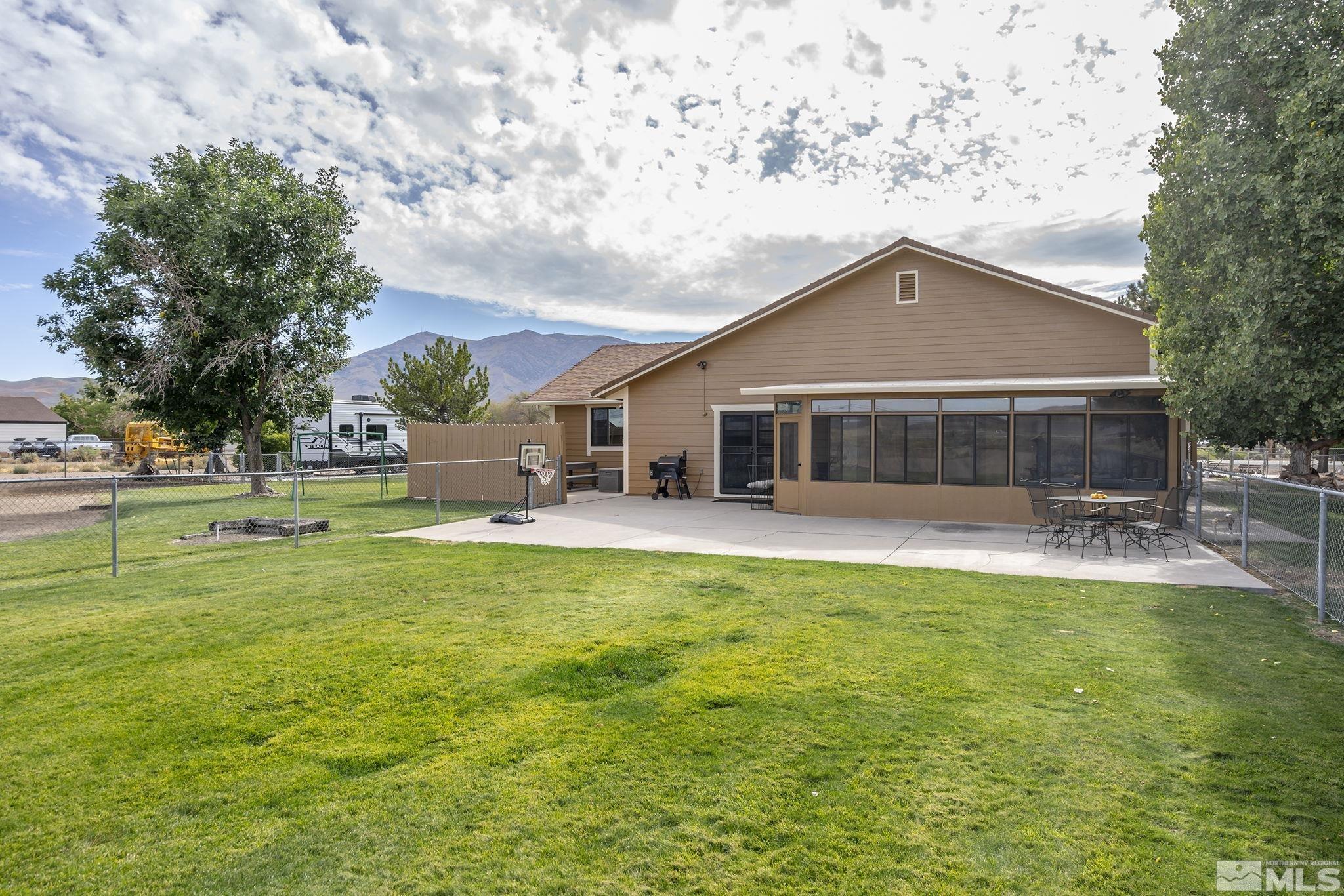 10890 Osage Road Reno, NV 89508 - Photo 27 of 40 a front view of a house with garden