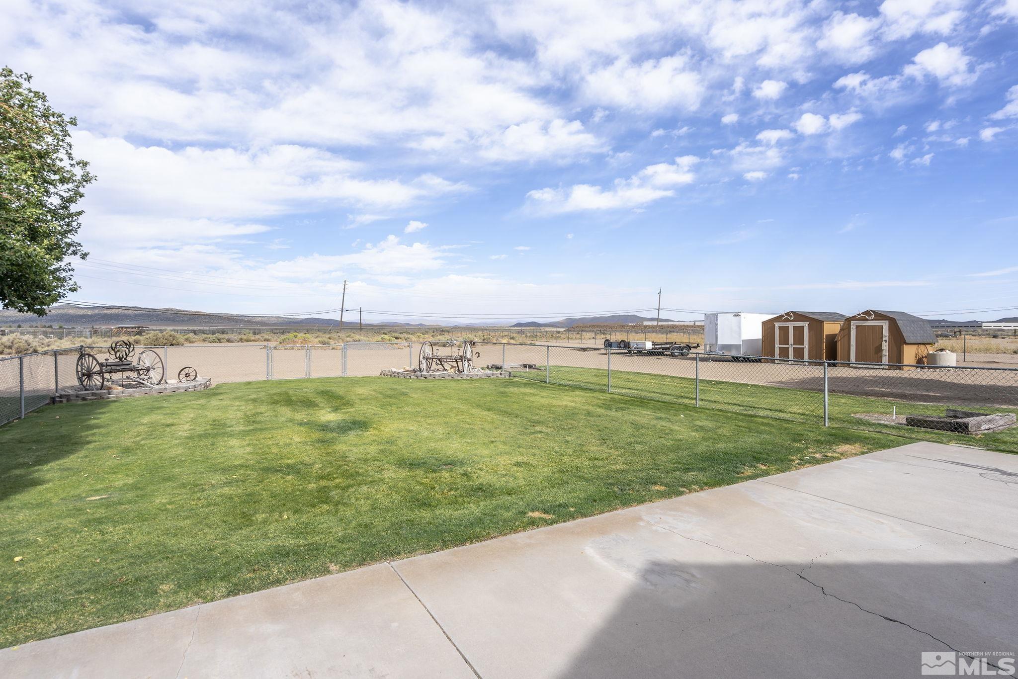 10890 Osage Road Reno, NV 89508 - Photo 28 of 40 a view of a big house with a big yard and large trees