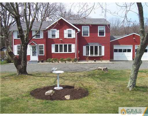 13 Yellowbrook Road Monmouth County, NJ 07728 - Photo 1 of 10 a front view of a house with a yard