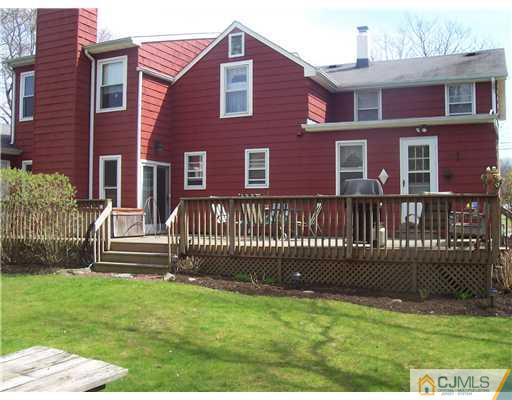 13 Yellowbrook Road Monmouth County, NJ 07728 - Photo 2 of 10 a front view of a house with a garden