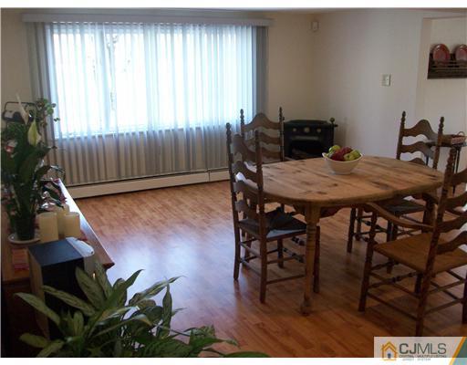 13 Yellowbrook Road Monmouth County, NJ 07728 - Photo 9 of 10 a view of a dining room with furniture and wooden floor