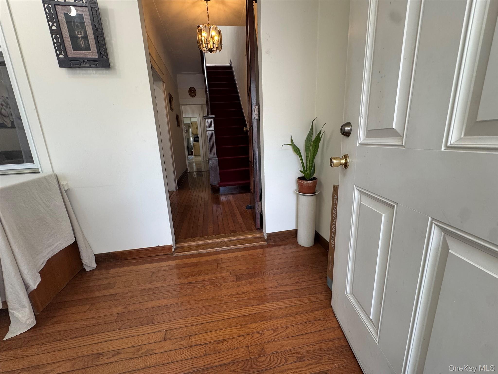 80-58 88th Road Queens, NY 11421 - Photo 3 of 21 a view of entryway with wooden floor