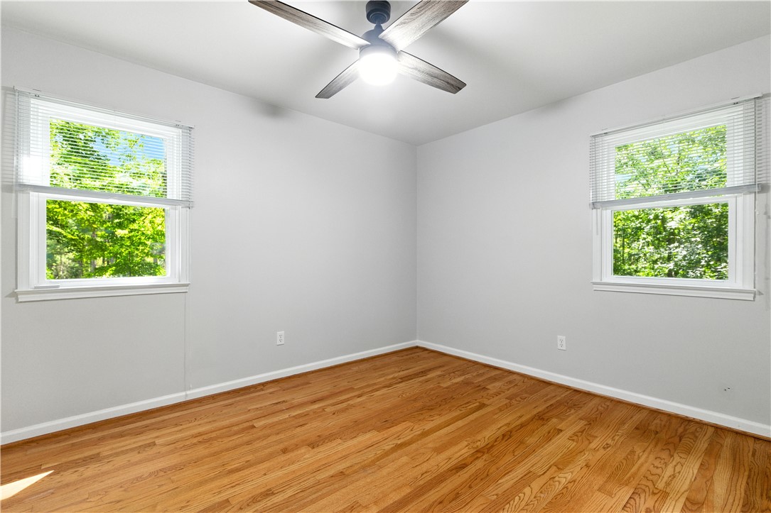 111 Braddock Road Williamsburg, VA 23185 - Photo 20 of 43 Spare room with light wood-style flooring, healthy amount of natural light, and ceiling fan