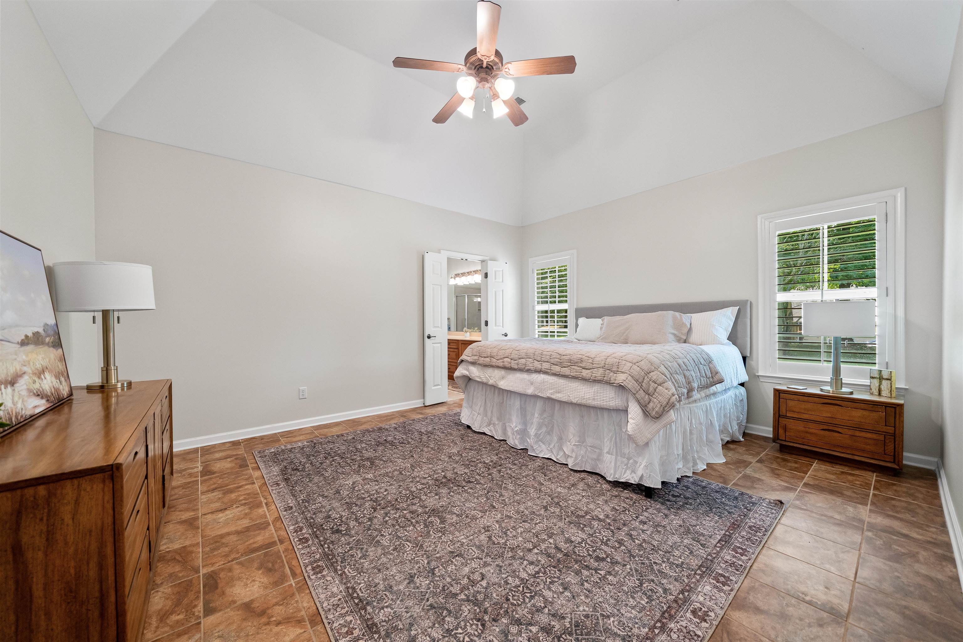 5035 Brian Ridge Road Arlington, TN 38002 - Photo 18 of 40 Vaulted ceiling bedroom featuring large windows, a ceiling fan with integrated lighting, and tile flooring