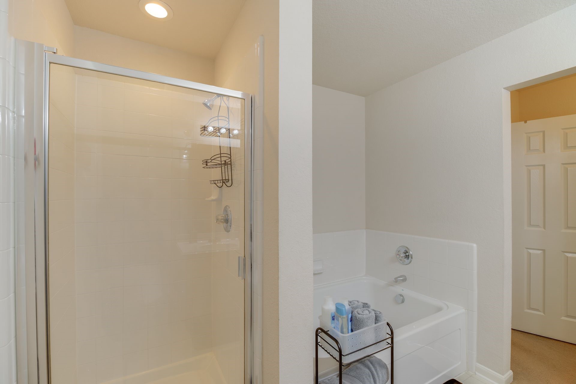 8019 Berkely Court Baytown, TX 77521 - Photo 10 of 13 a bathroom with a bathtub and a shower
