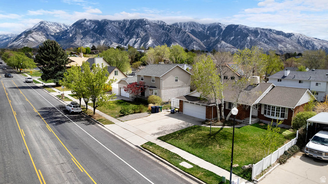 1822 East 9800th Street South Sandy, UT 84092 - Photo 9 of 38 Aerial perspective of suburban area featuring mountains