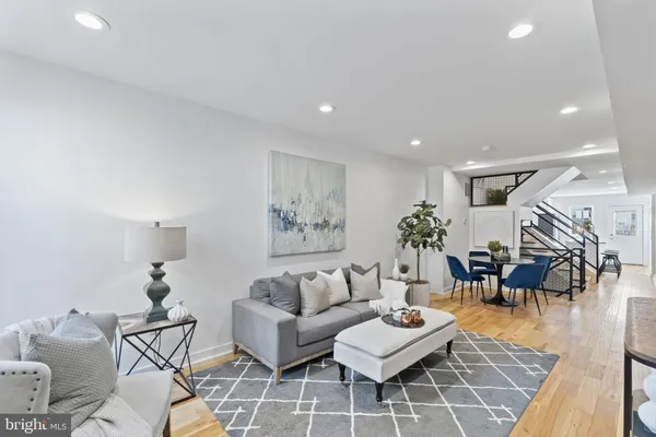 a living room with furniture and a table