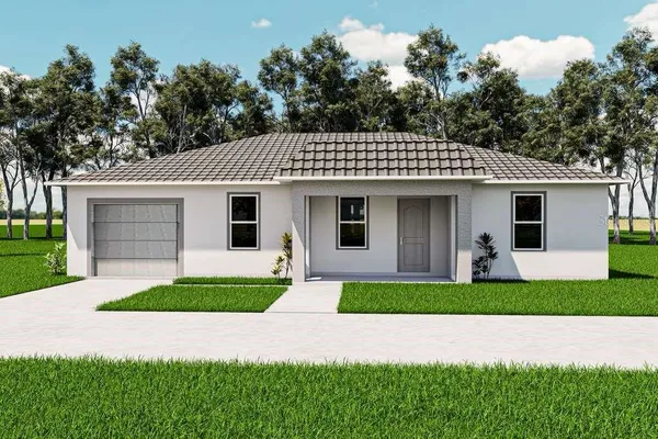 a front view of a house with a yard and garage