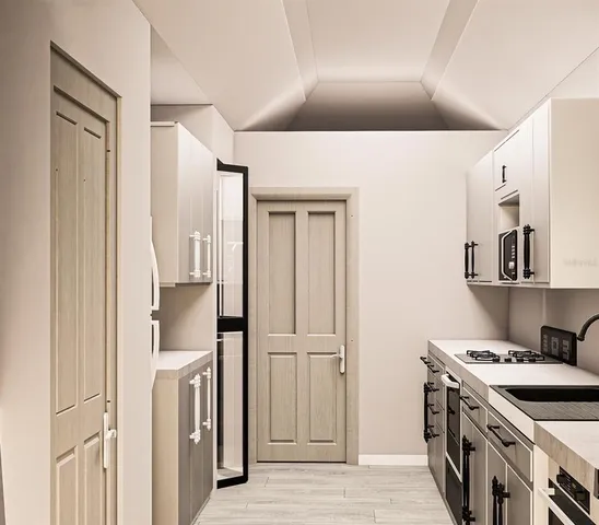 a kitchen with stainless steel appliances granite countertop a refrigerator and a stove