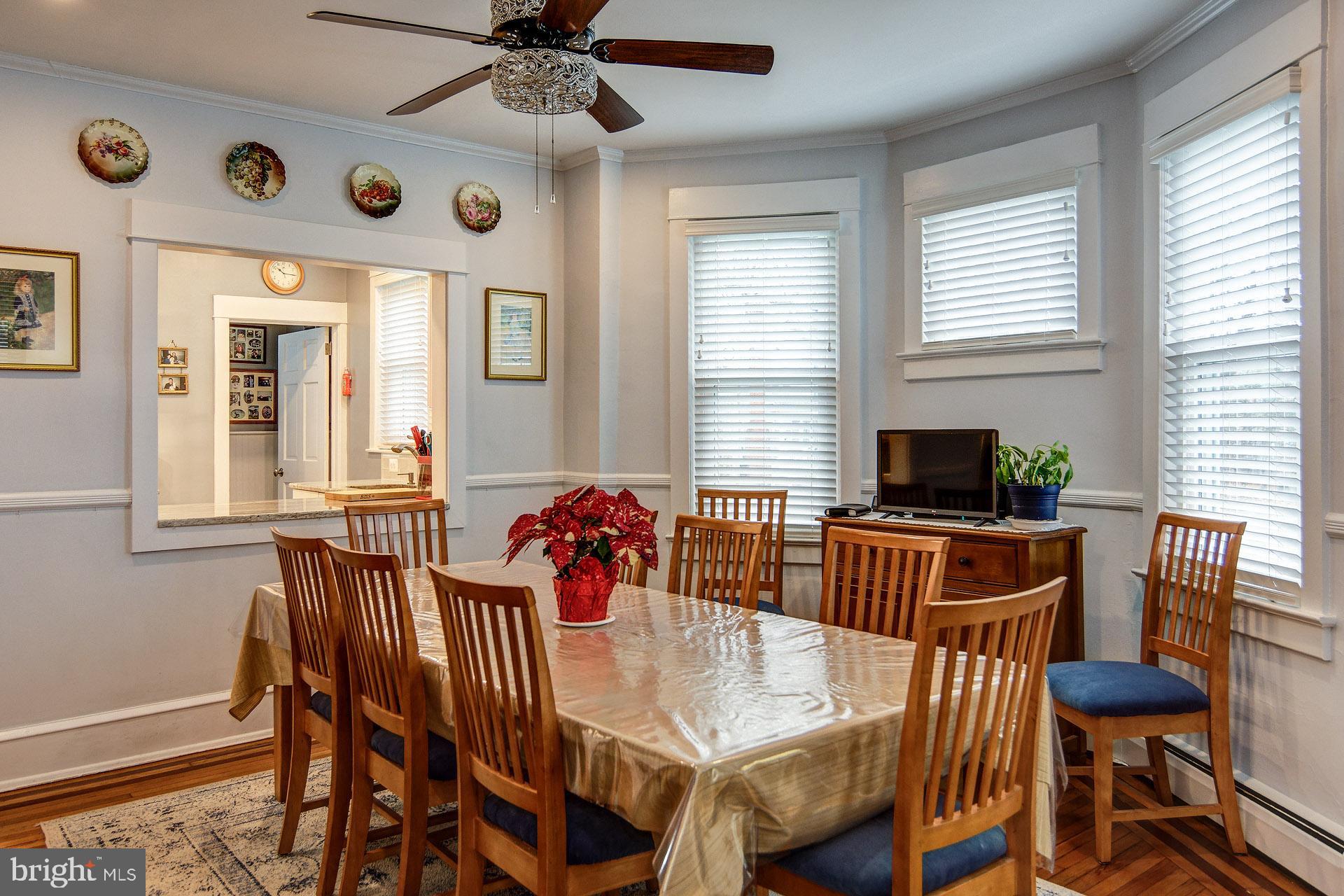 13 West Euclid Avenue Haddonfield, NJ 08033 - Photo 15 of 45 a view of a dining room with furniture window and wooden floor