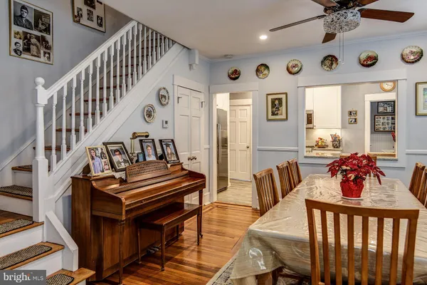 a bedroom with furniture and wooden floor
