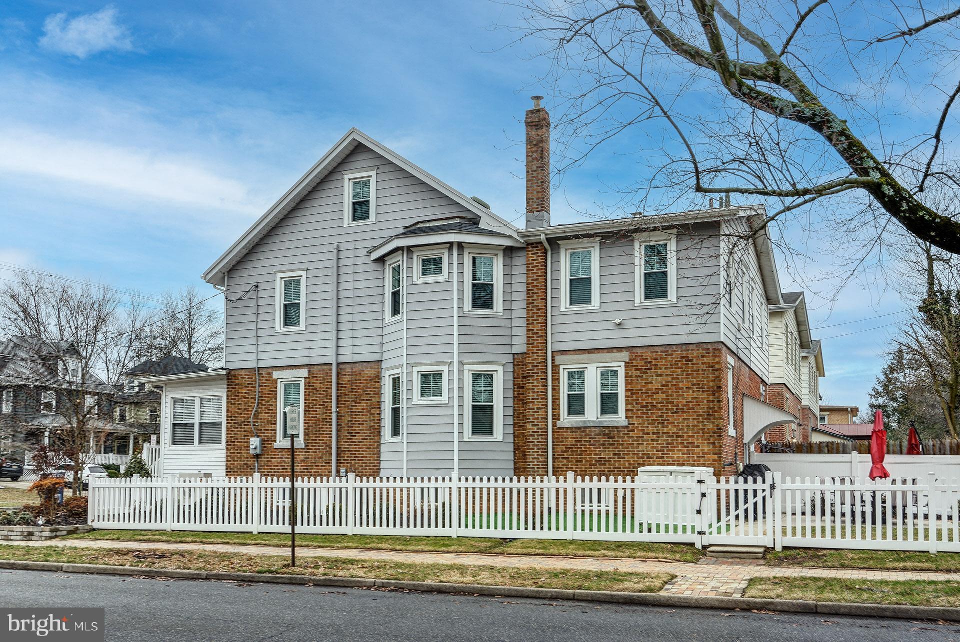 13 West Euclid Avenue Haddonfield, NJ 08033 - Photo 2 of 45 a front view of a house with a yard