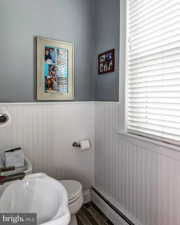 a bathroom with a toilet and a sink