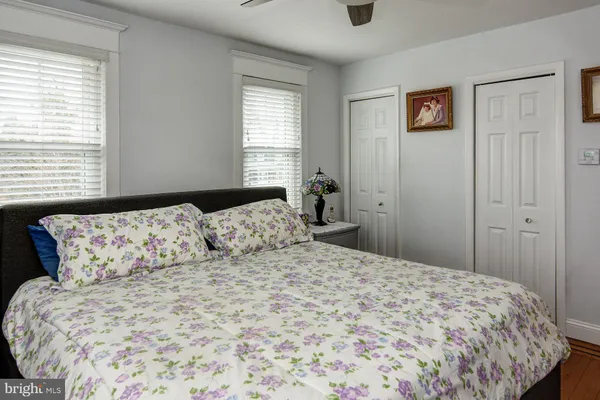 a bedroom with a large bed and a window