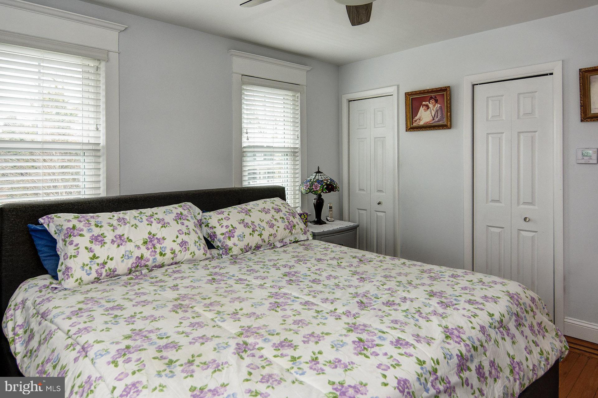 13 West Euclid Avenue Haddonfield, NJ 08033 - Photo 32 of 45 a bedroom with a large bed and a window