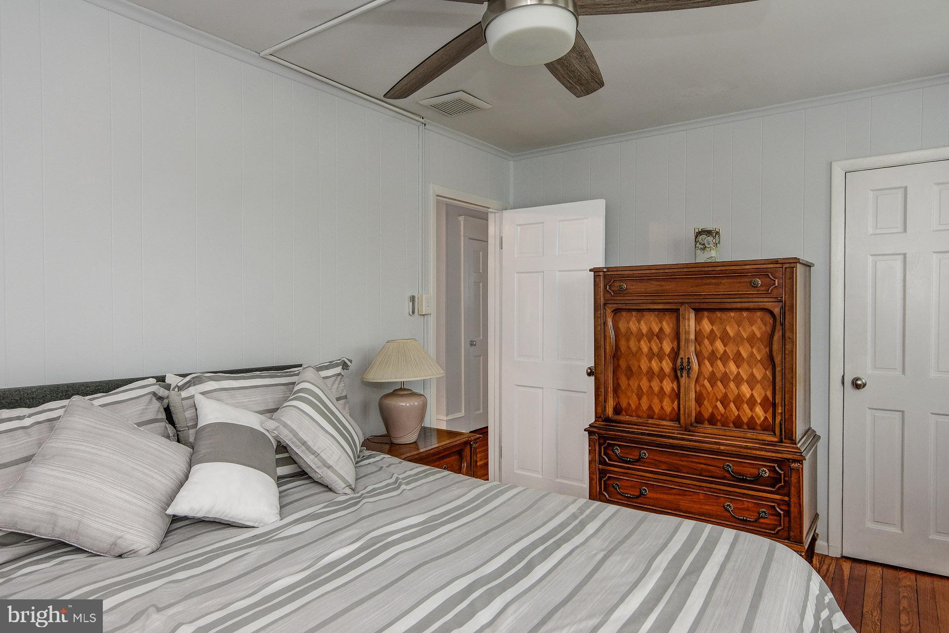 13 West Euclid Avenue Haddonfield, NJ 08033 - Photo 36 of 45 a bedroom with a bed and wooden floor