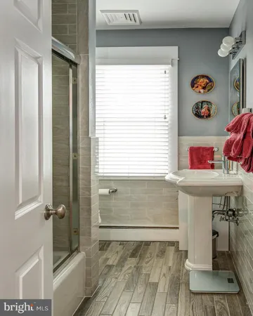 a bathroom with a sink and a shower