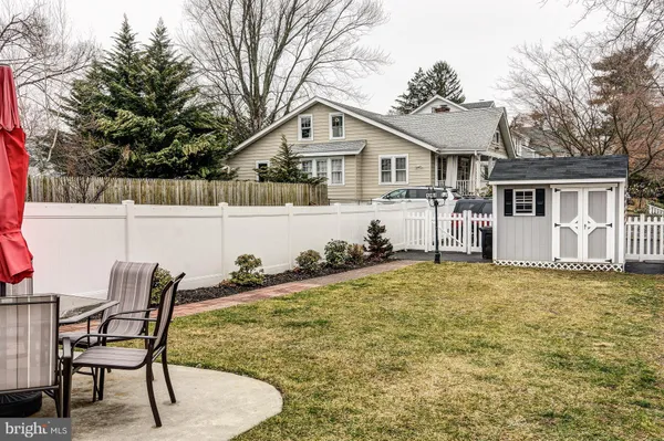 a front view of house with yard and seating area