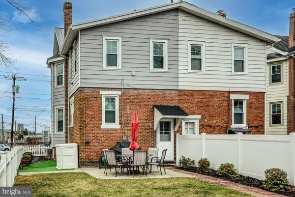 a front view of house with yard outdoor seating entrance