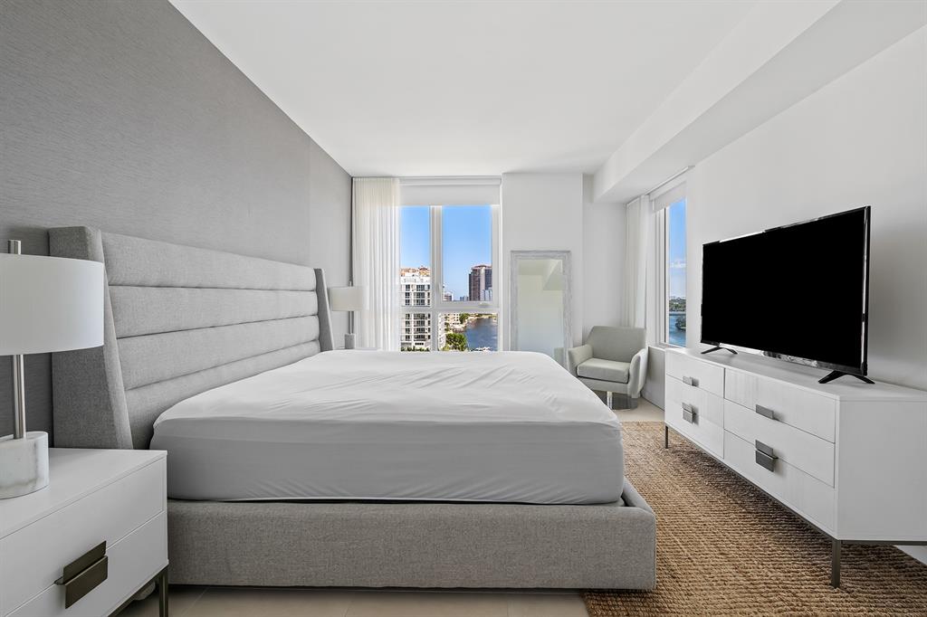 401 North Birch Road, Unit 1003 Fort Lauderdale, FL 33304 - Photo 7 of 26 a bedroom with a bed and a flat screen tv