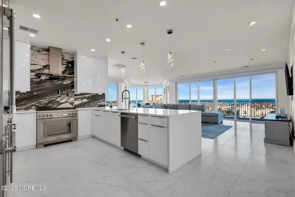 a kitchen with stainless steel appliances granite countertop a sink and cabinets