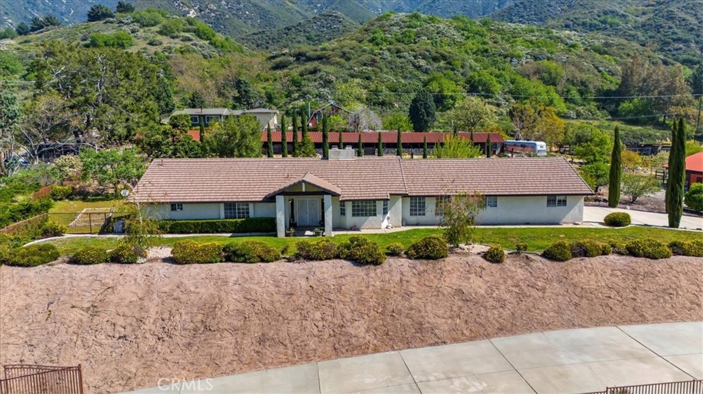 923 Devore Road San Bernardino, CA 92407 - Photo 1 of 75 a front view of a house with a yard