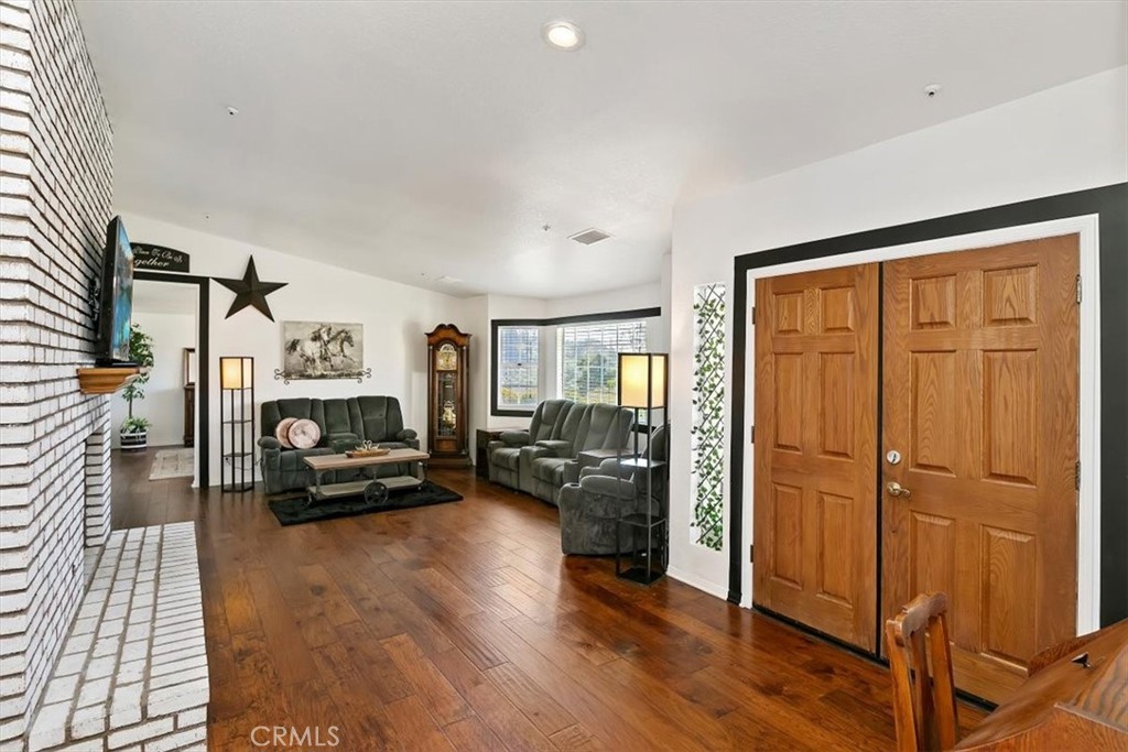 923 Devore Road San Bernardino, CA 92407 - Photo 13 of 75 a living room with furniture windows and a wooden floor