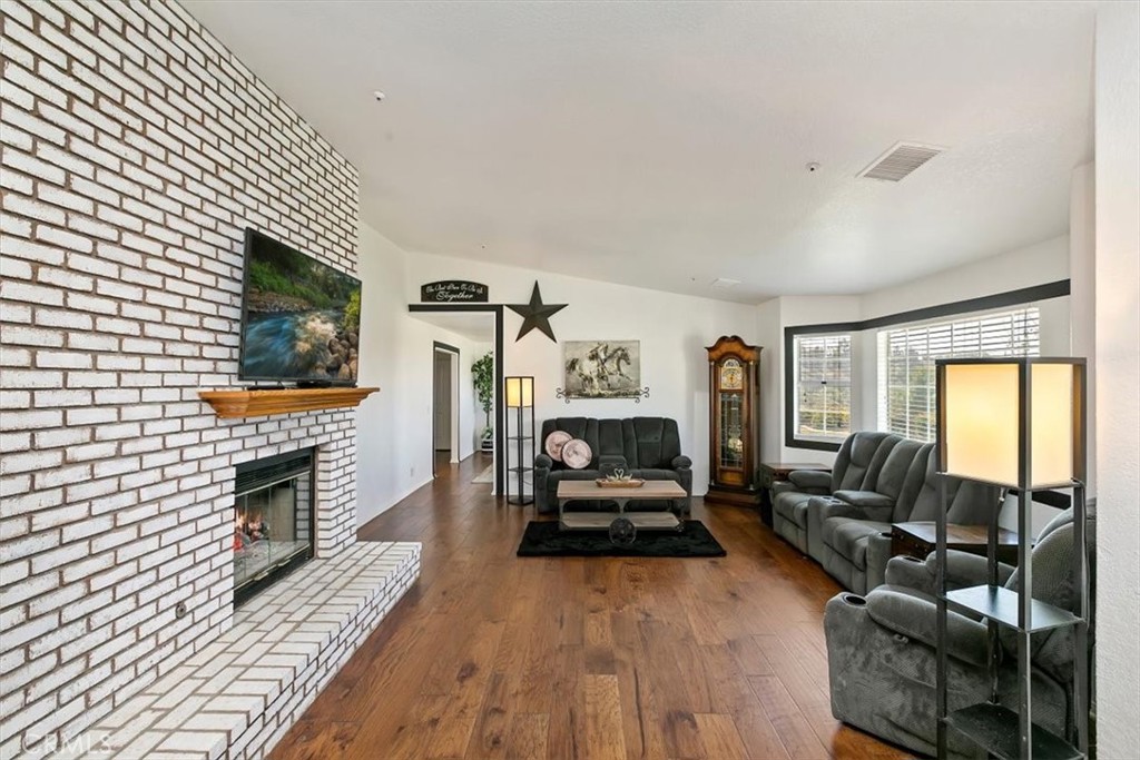 923 Devore Road San Bernardino, CA 92407 - Photo 15 of 75 a living room with furniture and a flat screen tv