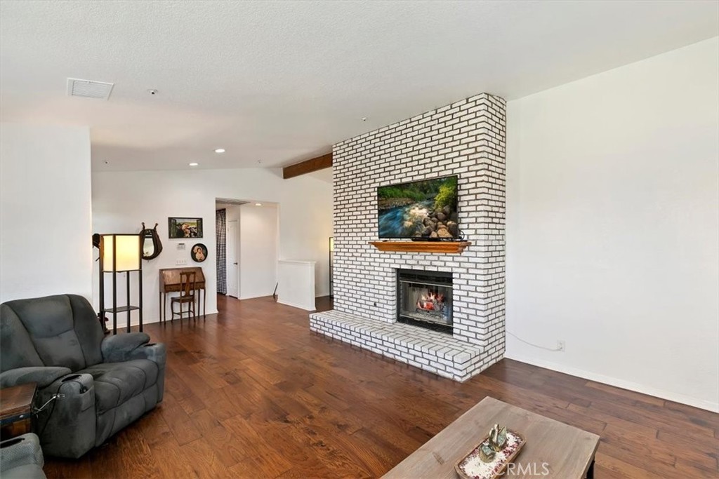 923 Devore Road San Bernardino, CA 92407 - Photo 16 of 75 a living room with furniture and a fireplace