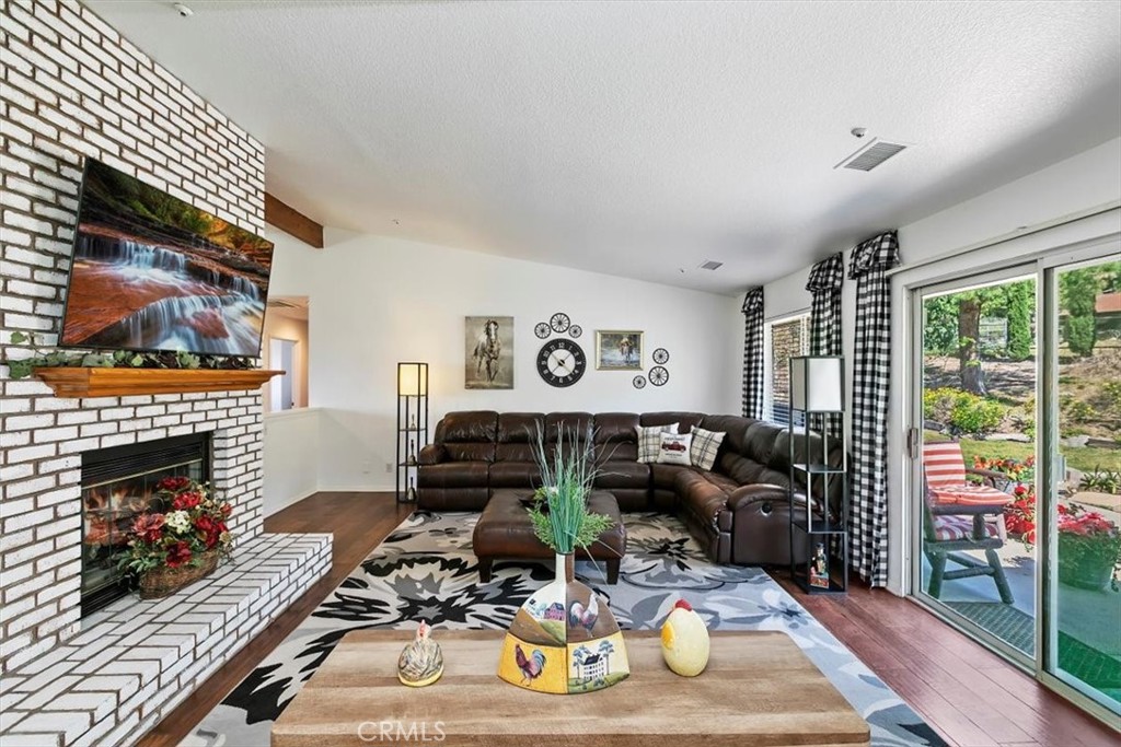 923 Devore Road San Bernardino, CA 92407 - Photo 18 of 75 a living room with furniture and a fireplace