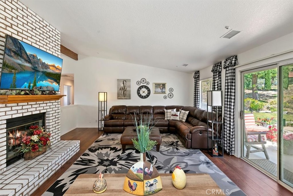 923 Devore Road San Bernardino, CA 92407 - Photo 20 of 75 a living room with furniture and a fireplace
