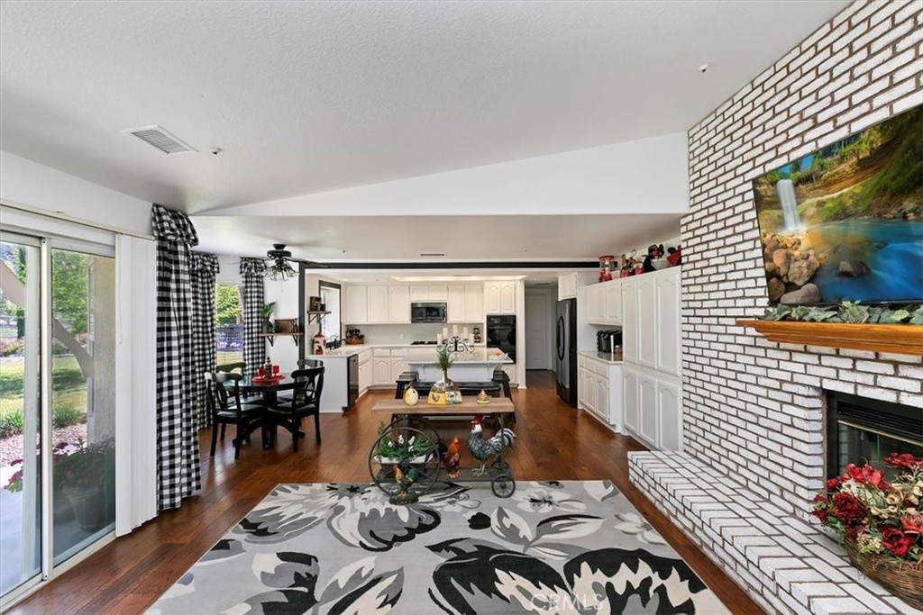 923 Devore Road San Bernardino, CA 92407 - Photo 21 of 75 a living room with furniture floor to ceiling window and wooden floor
