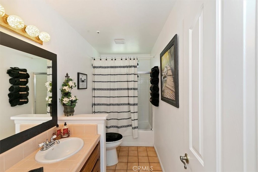 923 Devore Road San Bernardino, CA 92407 - Photo 32 of 75 a bathroom with a sink toilet and shower