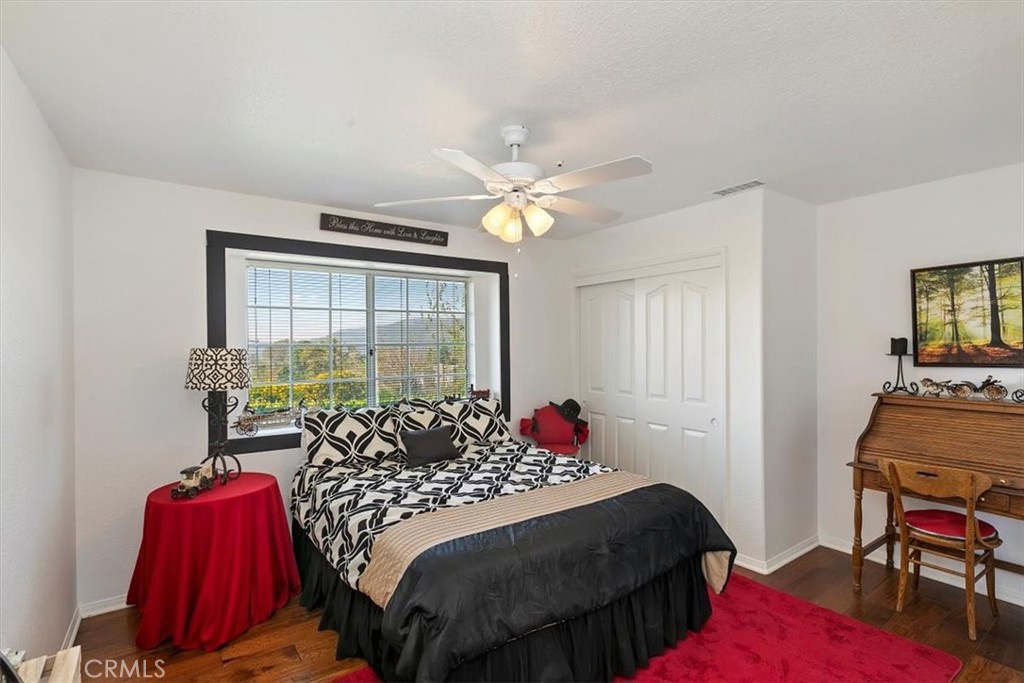 923 Devore Road San Bernardino, CA 92407 - Photo 33 of 75 a bedroom with a bed and a chandelier