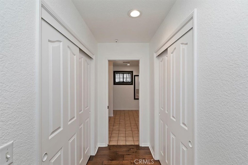 923 Devore Road San Bernardino, CA 92407 - Photo 36 of 75 a view of a hallway with wooden floor and entryway