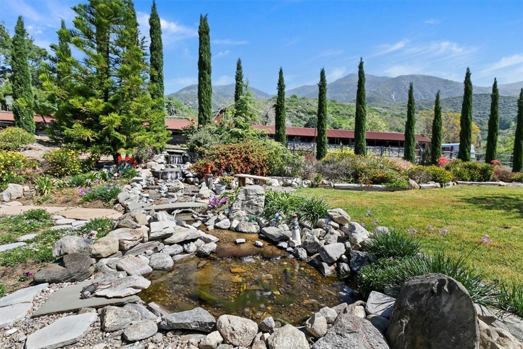 923 Devore Road San Bernardino, CA 92407 - Photo 44 of 75 a view of a garden with a lake view