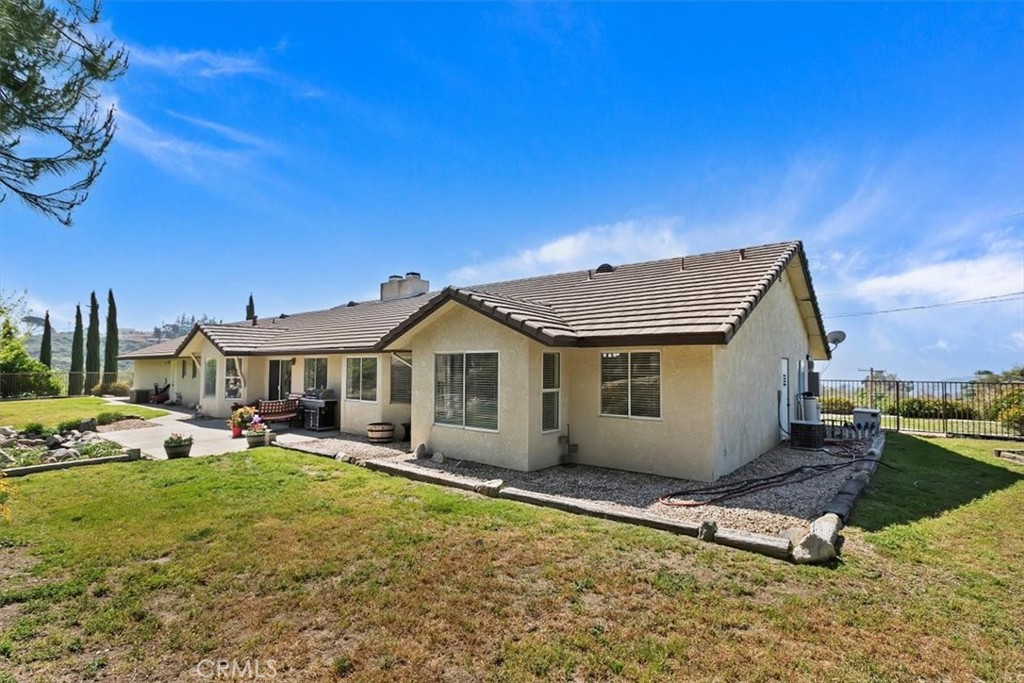 923 Devore Road San Bernardino, CA 92407 - Photo 48 of 75 a view of a house with a yard and sitting area