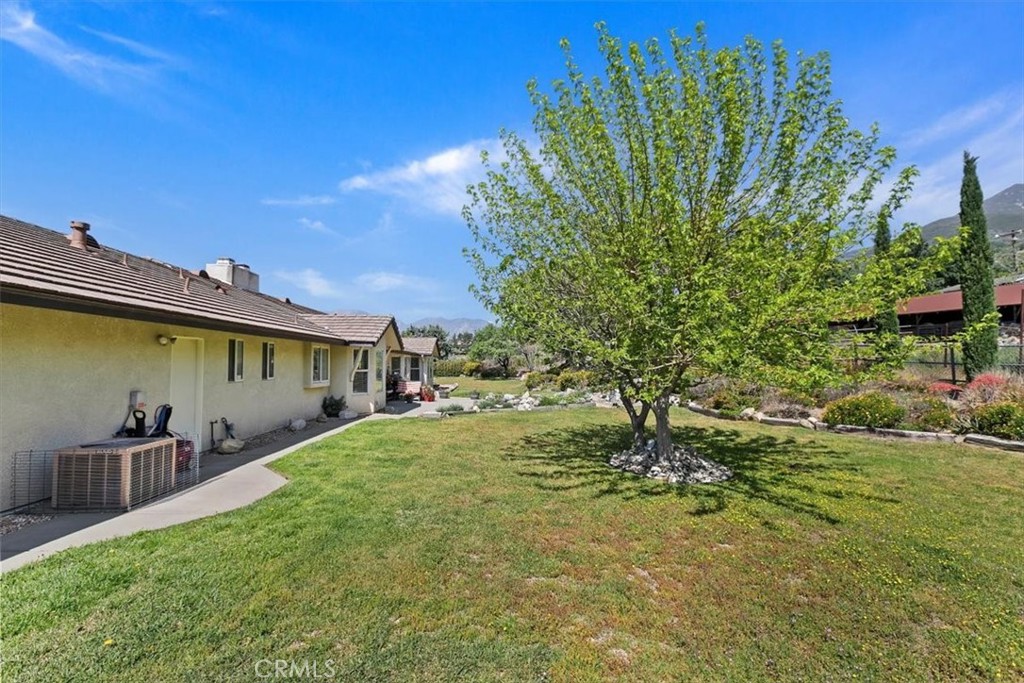 923 Devore Road San Bernardino, CA 92407 - Photo 49 of 75 a backyard of a house with table and chairs