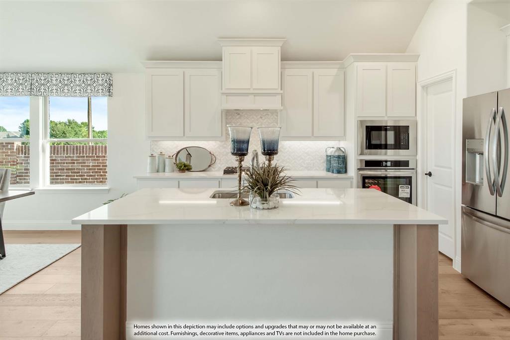 14525 Jemison Street Pilot Point, TX 76258 - Photo 13 of 39 a view of kitchen with stainless steel appliances granite countertop a stove and a refrigerator