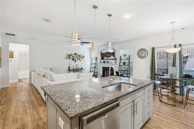 a kitchen with granite countertop living room and living room