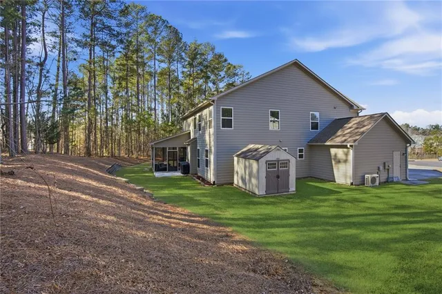 a front view of house with yard and green space