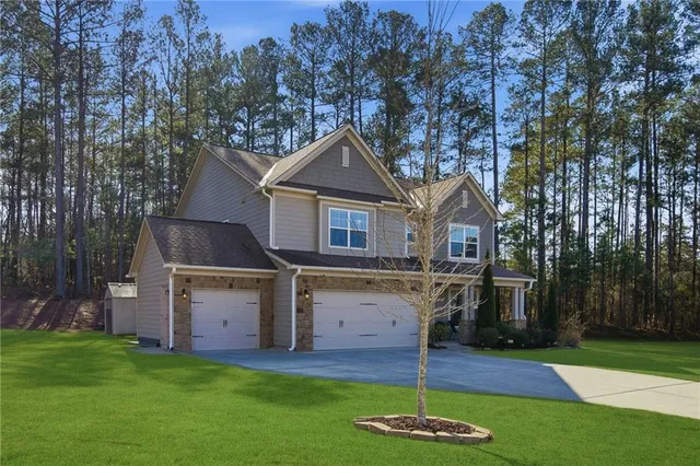 a front view of a house with a yard