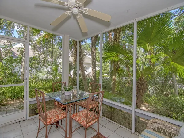 a view of a porch with furniture and yard
