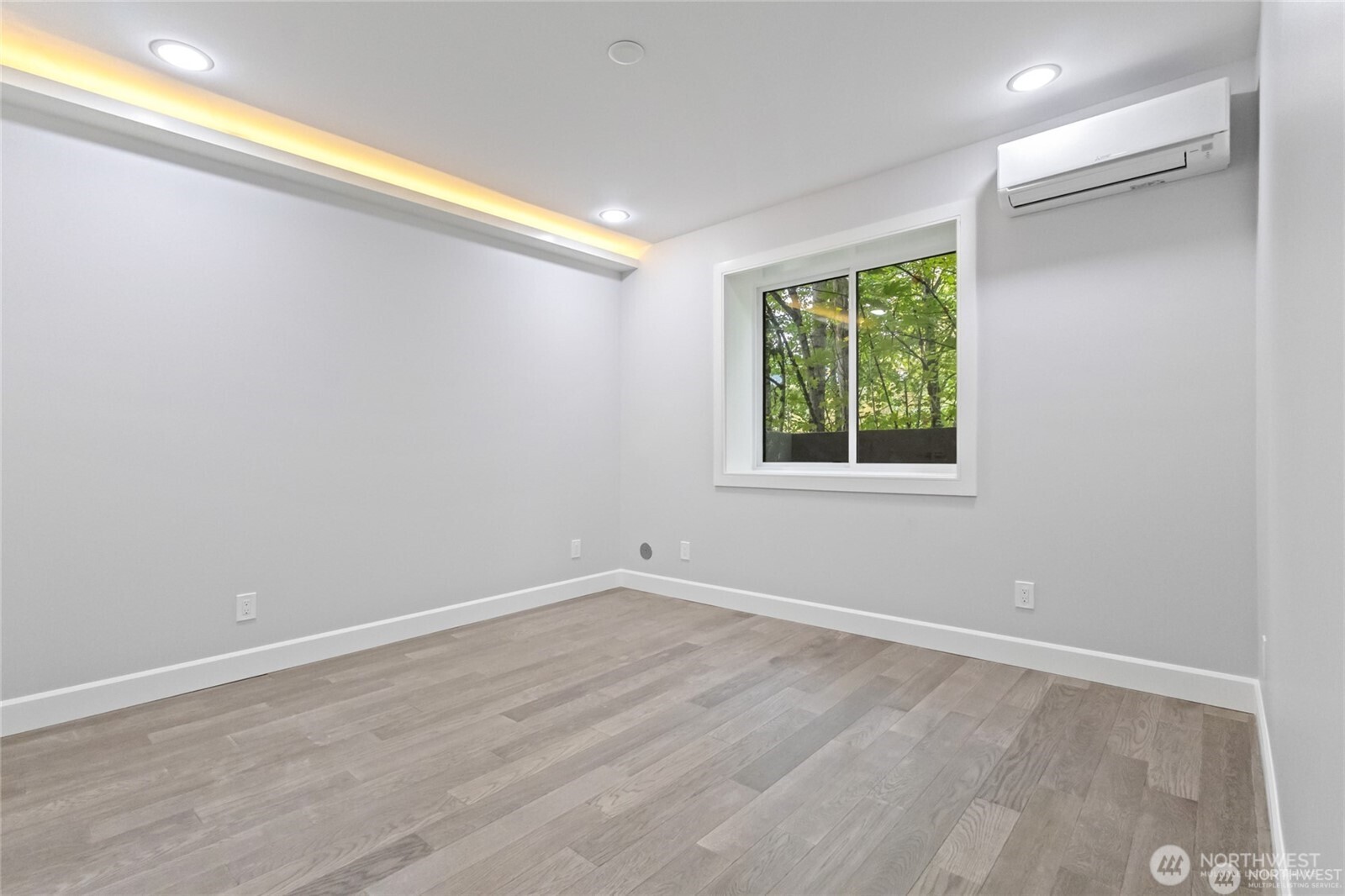 4413 Northeast 26th Court Renton, WA 98059 - Photo 25 of 28 wooden floor in an empty room with a window