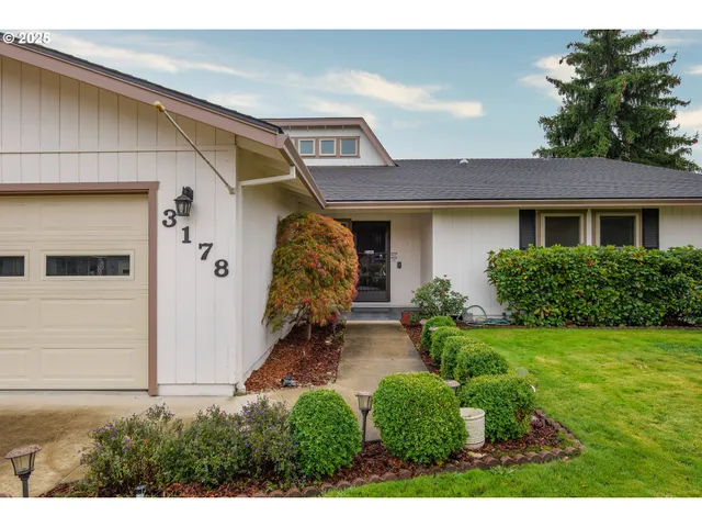 a front view of a house with garden