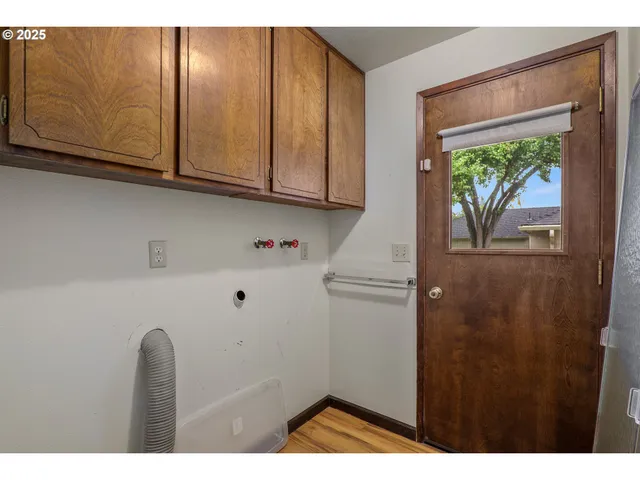 a view of hallway with washer and dryer