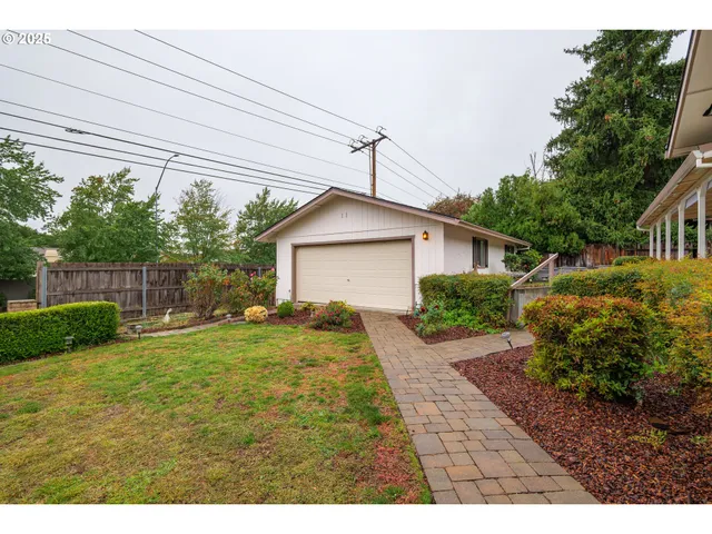 a kitchen with stainless steel appliances a sink counter space and a refrigerator