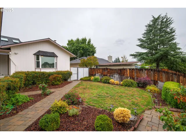 a house view with a garden space