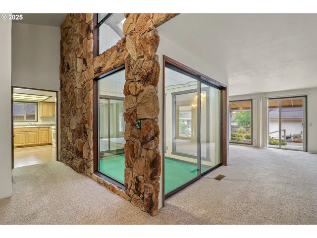 a view of a house with backyard and porch